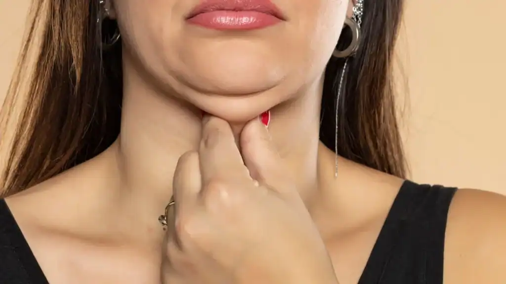 An image of a woman with double chin, sad, worried : Non Surgical Double Chin Removal Treatment in West Bridgford, UK